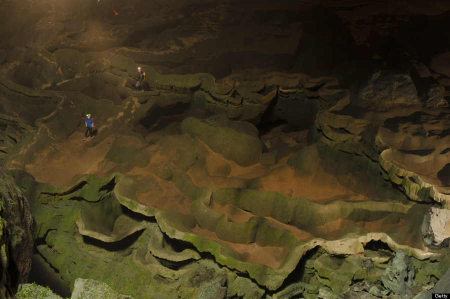 VIETNAM - MAY 02:  Hang Son Doong explorers navigate an algae-covered cavescape. Phong Nha Ke Bang National Park, Vietnam.  (Photo by Carsten Peter/National Geographic/Getty Images)